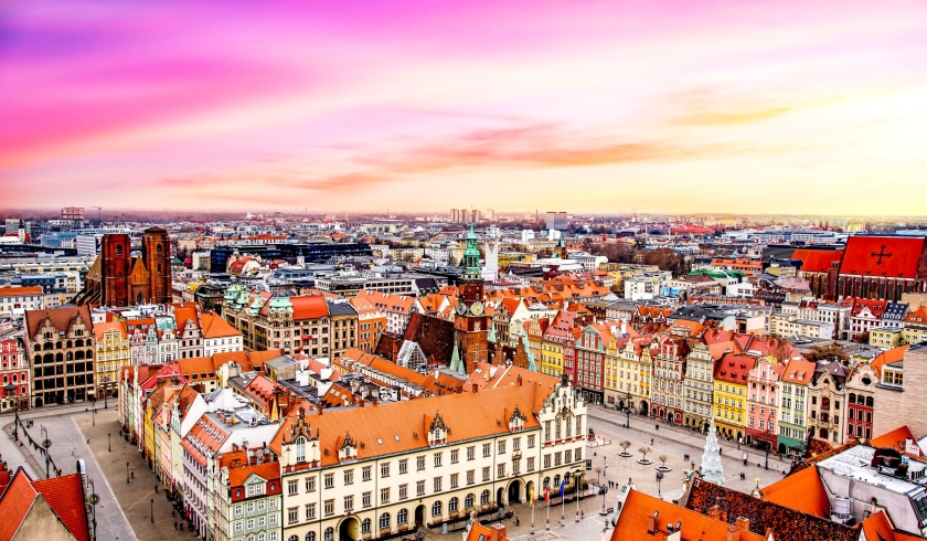 152653577 - the city of wroclaw, a beautiful view of the bright roofs of the houses. old town from the height of bird flight, at dawn or sunset